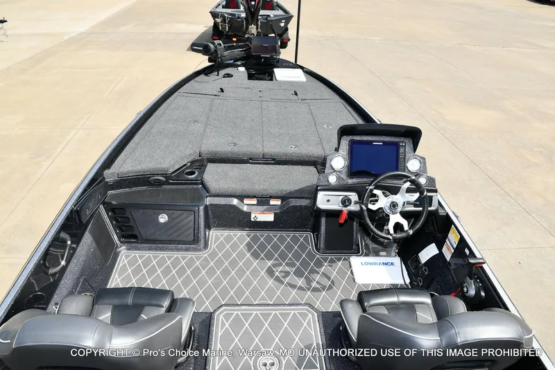 Slide: The Image of 2022 Nitro Z21 XL Pro boat interior with steering console and seating. - 8