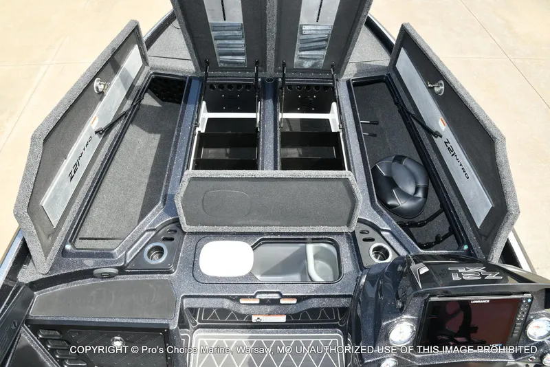Slide: The Image of 2022 Nitro Z21 XL Pro boat interior with open storage compartments and control panel. - 9