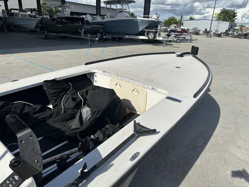Slide: The Image of 2006 Beavertail Skiffs 16 boat in a parking lot, surrounded by other boats. - 2