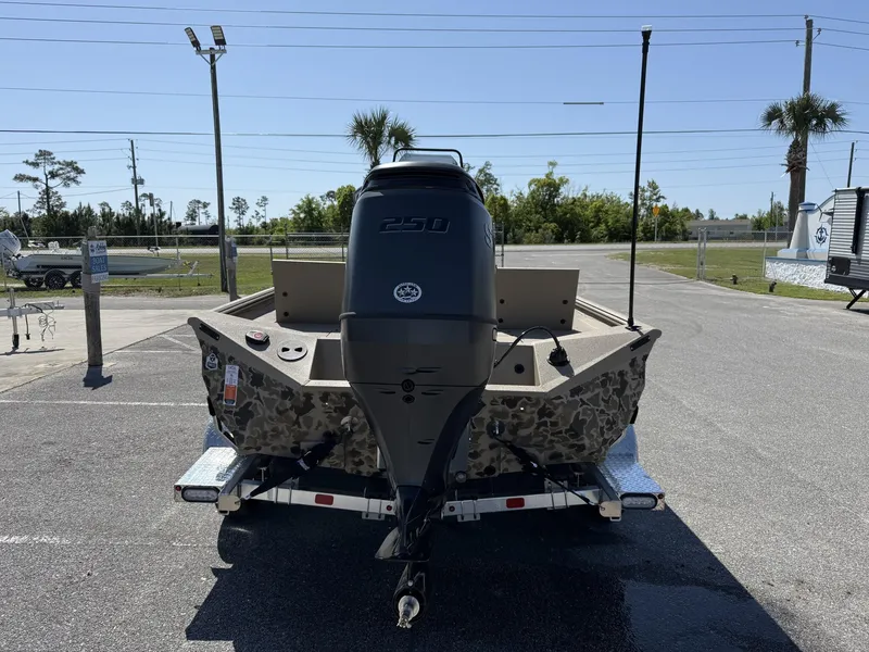 Slide: The Image of 2025 Excel New Bay Pro 230 boat with camouflage design and powerful outboard motor. - 3