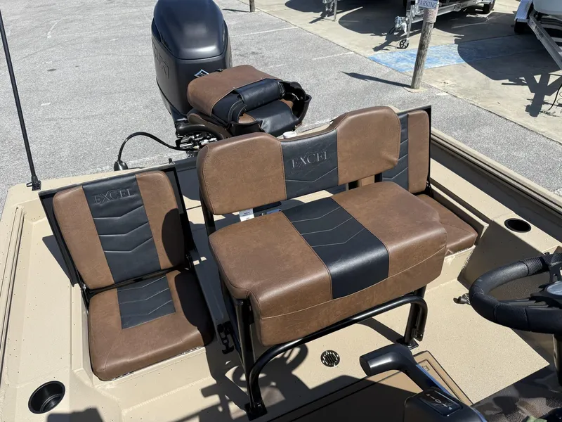 Slide: The Image of 2025 Excel New Bay Pro 230 boat seats with brown and black upholstery. - 5