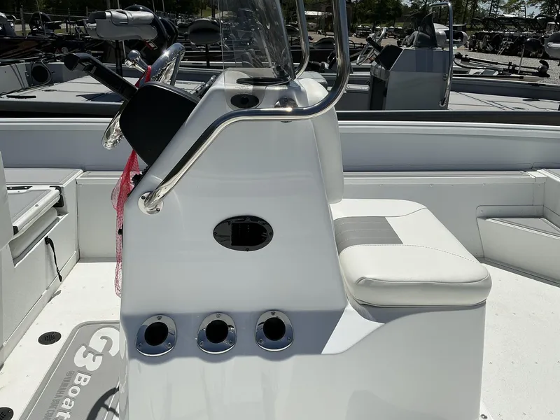 Slide: The Image of 2025 G3 Bay 20 boat interior with steering console and seating. - 4