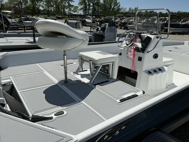 Slide: The Image of 2025 G3 Bay 20 boat interior with steering console, seating, and spacious deck. - 6