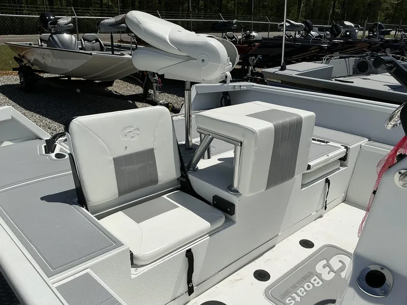 Slide: The Image of 2025 G3 Bay 20 boat interior with white seating and modern design. - 9