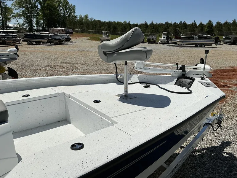 Slide: The Image of 2025 Xpress Hyper-Lift Series H20B boat with new console, parked outdoors. - 3