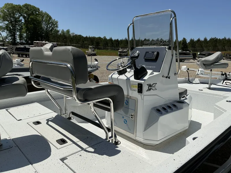Slide: The Image of 2025 Xpress Hyper-Lift Series H20B boat console with seating, steering, and controls. - 6