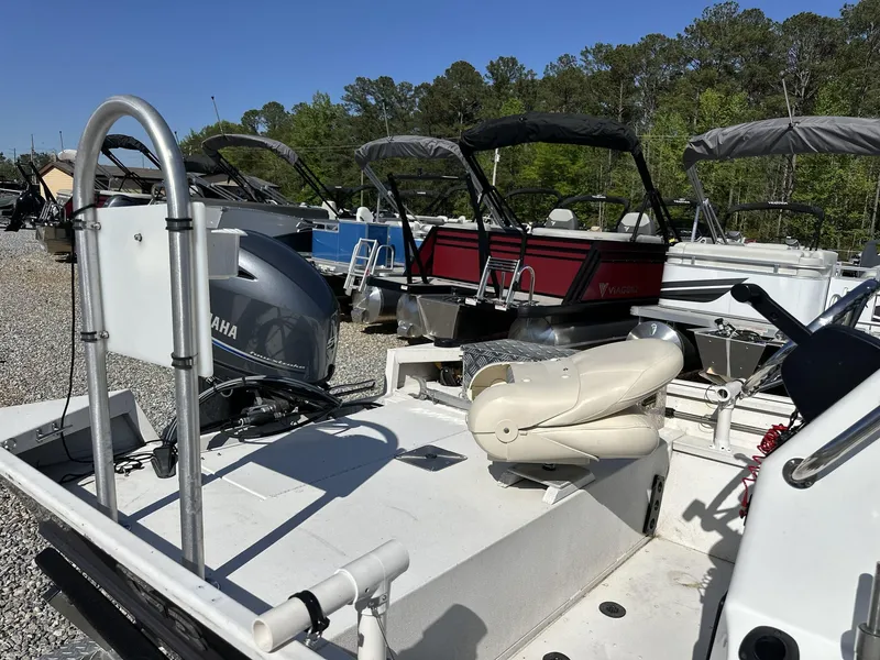 Slide: The Image of 2022 G3 Bay 17 BAY boat with Yamaha motor, parked among other boats. - 11