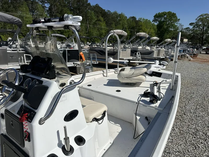 Slide: The Image of 2022 G3 Bay 17 BAY boat with console and seating, displayed outdoors on gravel. - 7