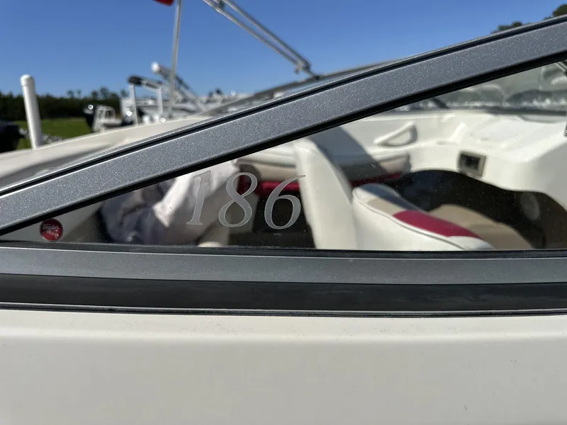 Slide: The Image of 2007 Caravelle 182 186 Model boat interior with visible seating and window detail. - 11