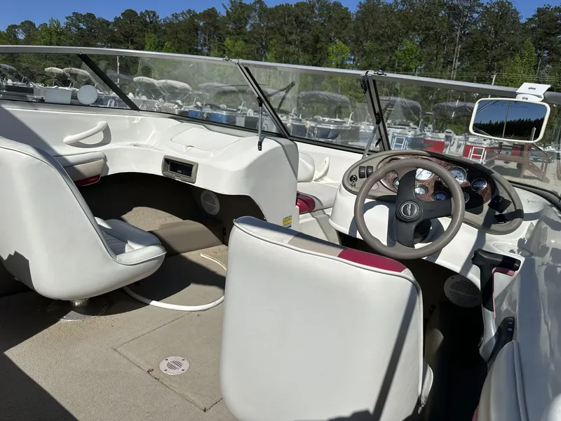 Slide: The Image of Interior of a 2007 Caravelle 182 186 MODEL boat with steering wheel and seating. - 8