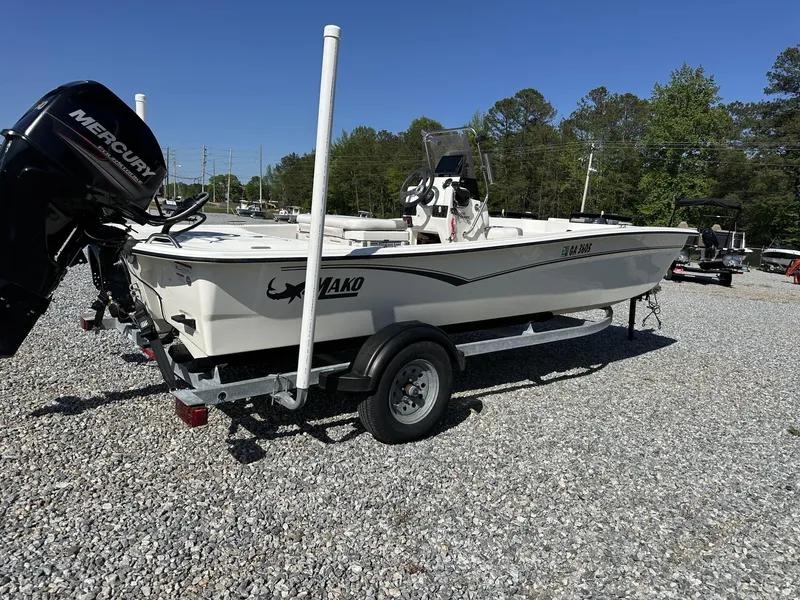 Slide: The Image of 2019 Mako Pro Skiff 17 boat on trailer with Mercury outboard motor. - 11