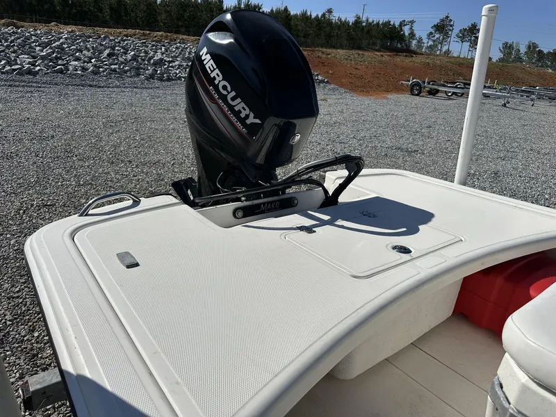 Slide: The Image of 2019 Mako Pro Skiff 17 with Mercury outboard motor on gravel lot. - 8