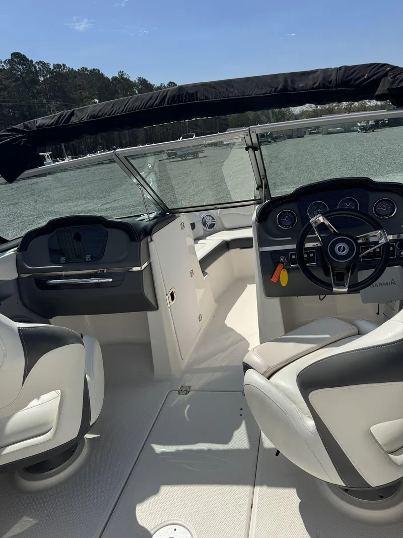 Slide: The Image of 2014 Chaparral 206 SSi boat interior with steering wheel and seating. - 9