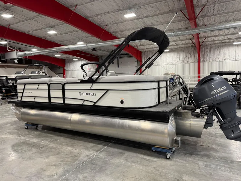 Slide: The Image of 2023 Sweetwater 2286 pontoon boat with Yamaha motor in a showroom. - 3