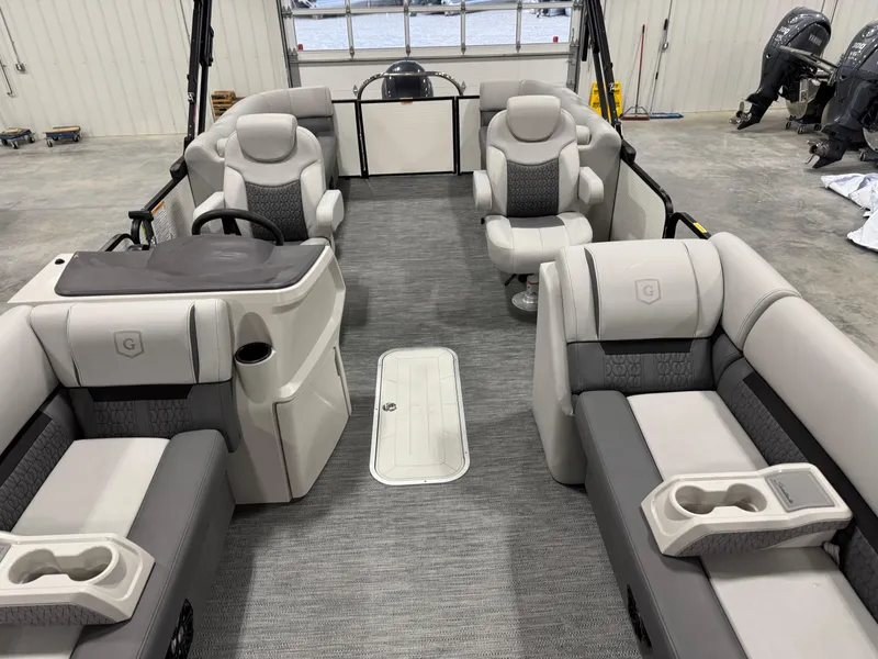 Slide: The Image of 2023 Sweetwater 2286 pontoon boat interior with plush seating and modern design. - 9