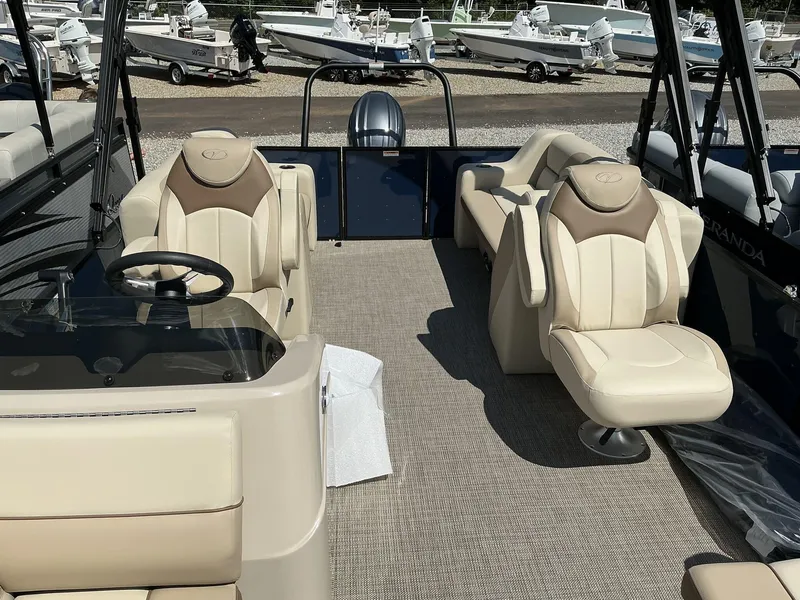 Slide: The Image of 2025 Veranda Vista View Series boat interior with luxurious seating and steering console. - 6