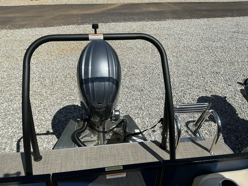 Slide: The Image of 2025 Veranda Vista View Series boat with outboard motor and safety railing. - 9