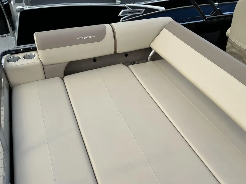 Slide: The Image of 2025 Veranda Relax Series VR22VLC boat seating with beige upholstery and cup holders. - 11