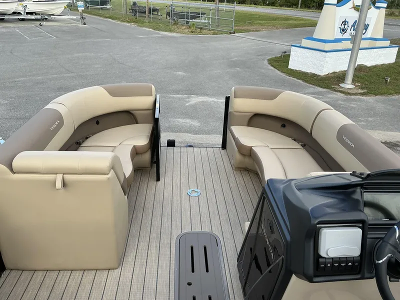 Slide: The Image of 2025 Veranda Relax Series VR22VLC pontoon boat with spacious seating and modern dashboard. - 12