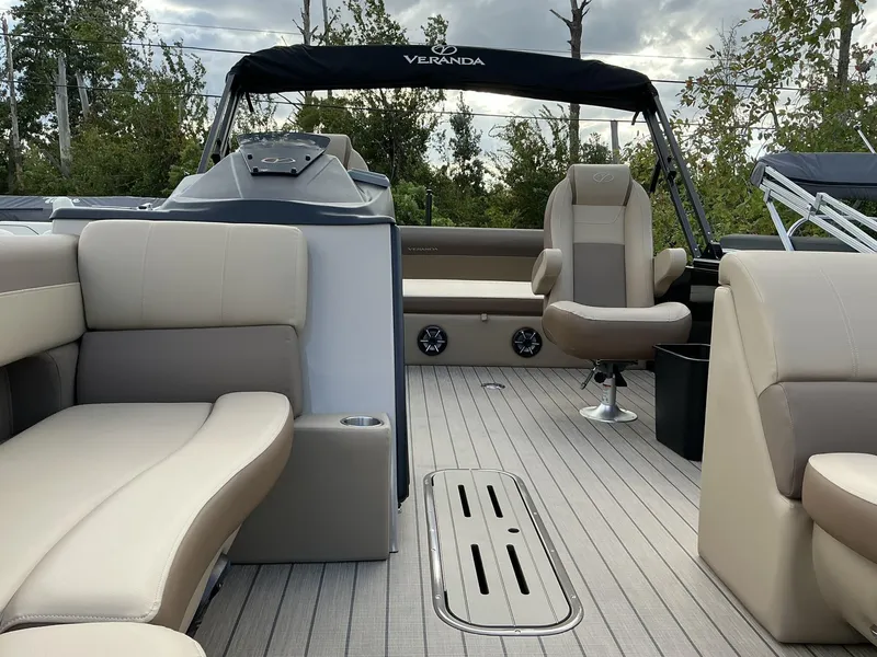 Slide: The Image of 2025 Veranda Relax Series VR22VLC pontoon boat interior with plush seating and modern design. - 4