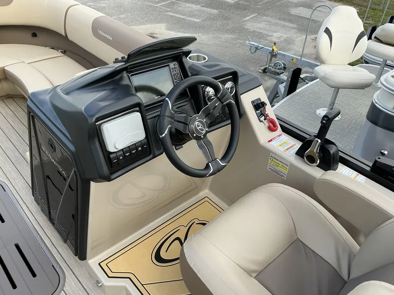 Slide: The Image of 2025 Veranda Relax Series VR22VLC boat cockpit with steering wheel and control panel. - 6