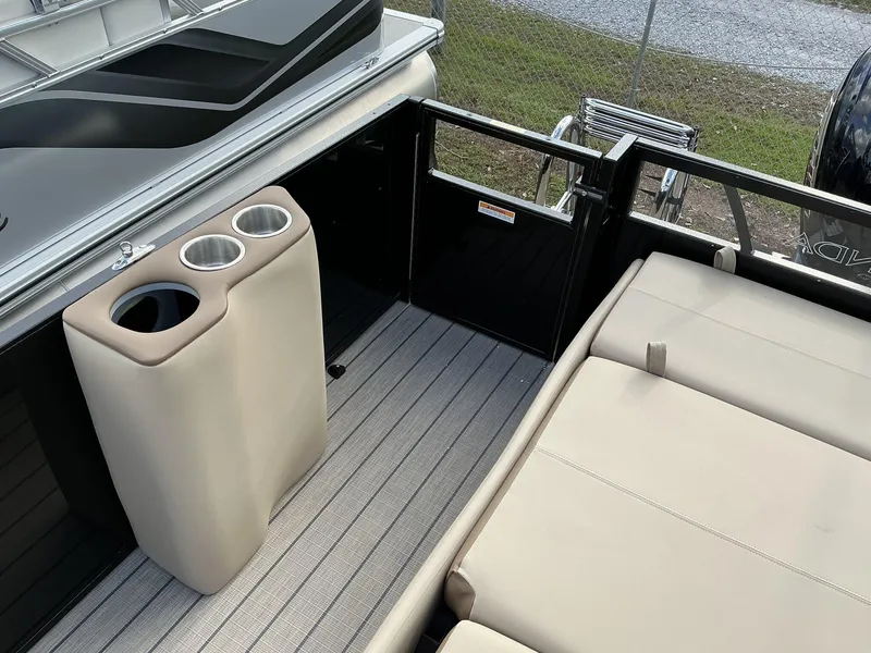 Slide: The Image of 2025 Veranda Relax Series VR22VLC boat interior with cup holders and seating. - 8