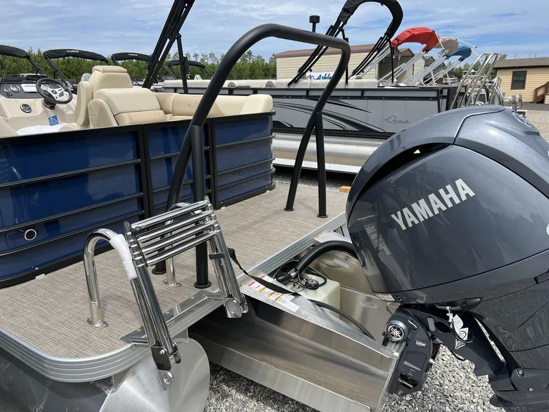 Slide: The Image of 2025 Veranda Vista View Series pontoon boat with Yamaha engine, docked outdoors. - 3