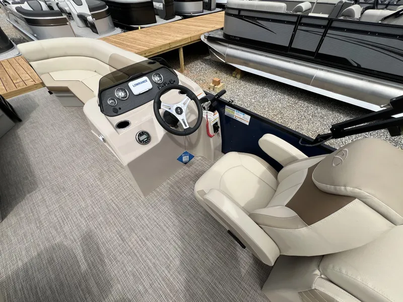 Slide: The Image of 2025 Veranda Vista View Series boat interior with steering console and seating. - 6