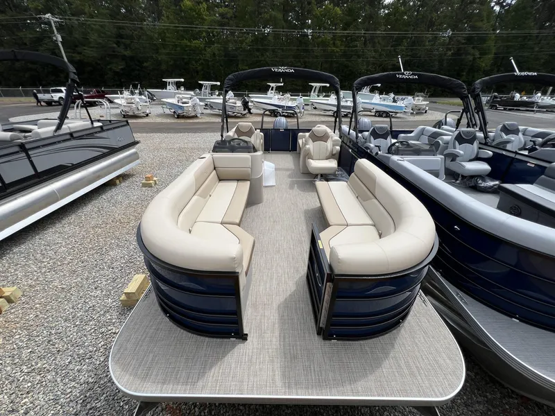 Slide: The Image of 2025 Veranda Vista View Series pontoon boat with spacious seating, displayed outdoors. - 7