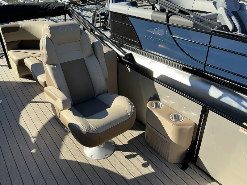 Slide: The Image of 2025 Veranda Relax Series 22RC boat interior with beige seating and cup holders. - 17