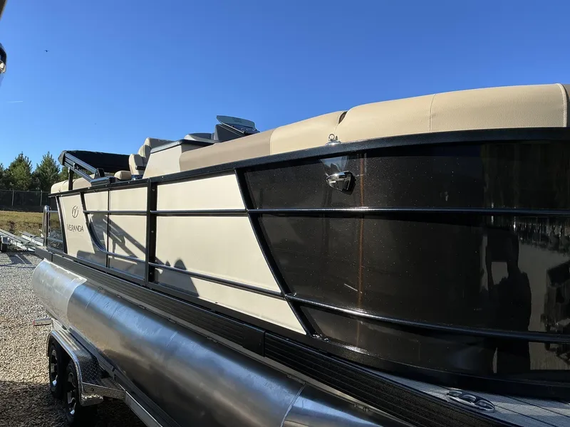 Slide: The Image of 2025 Veranda Relax Series 22RC pontoon boat under clear blue sky. - 3