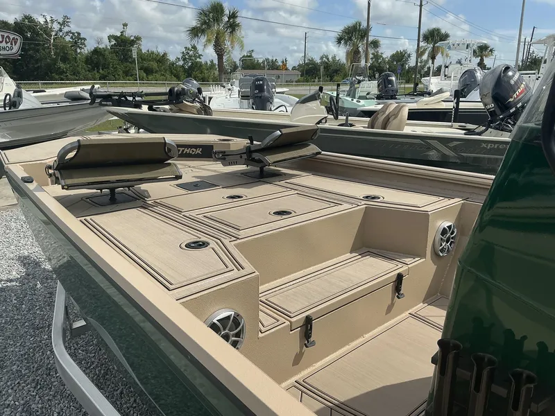 Slide: The Image of 2025 Thor LAKE HAMMER 1900 CC boat interior with seating and storage compartments. - 11