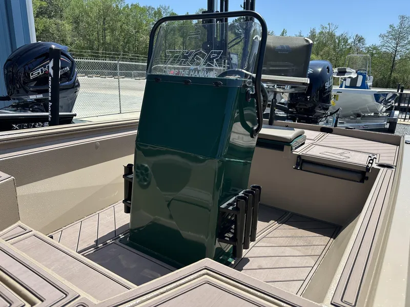 Slide: The Image of 2025 Thor LAKE HAMMER 1900 CC boat interior with green console and seating. - 7