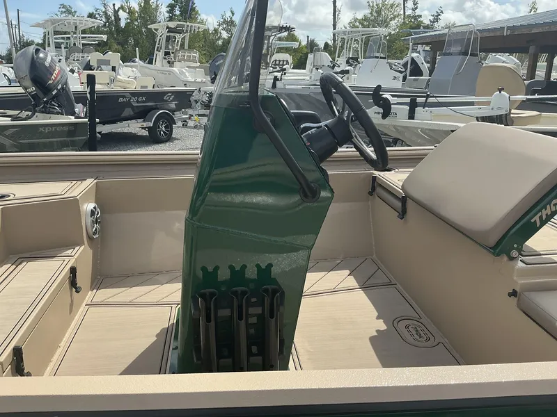 Slide: The Image of 2025 Thor LAKE HAMMER 1900 CC boat interior with steering console and seating. - 8