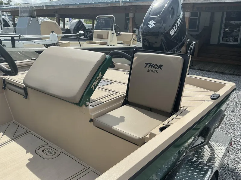 Slide: The Image of 2025 Thor LAKE HAMMER 1900 CC boat interior with Suzuki outboard motor. - 9