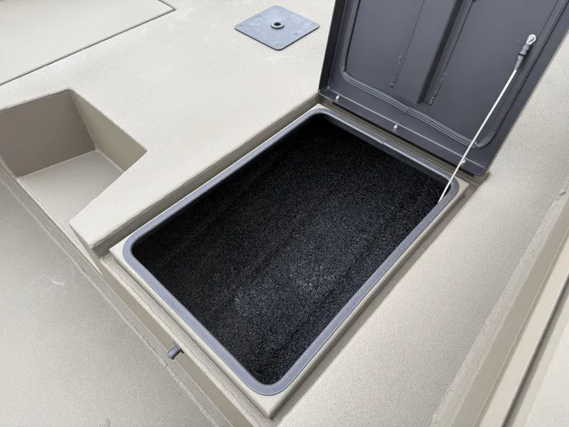 Slide: The Image of Open storage compartment on 2025 Thor LAKE HAMMER 1860 boat deck. - 10