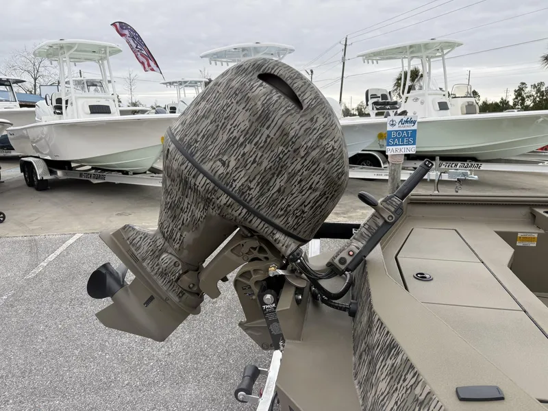 Slide: The Image of 2025 Thor LAKE HAMMER 1860 boat motor in a sales parking lot. - 4