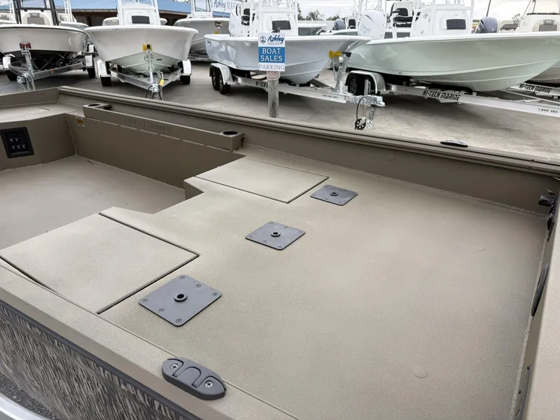 Slide: The Image of 2025 Thor LAKE HAMMER 1860 boat interior with storage compartments, displayed at a sales lot. - 5