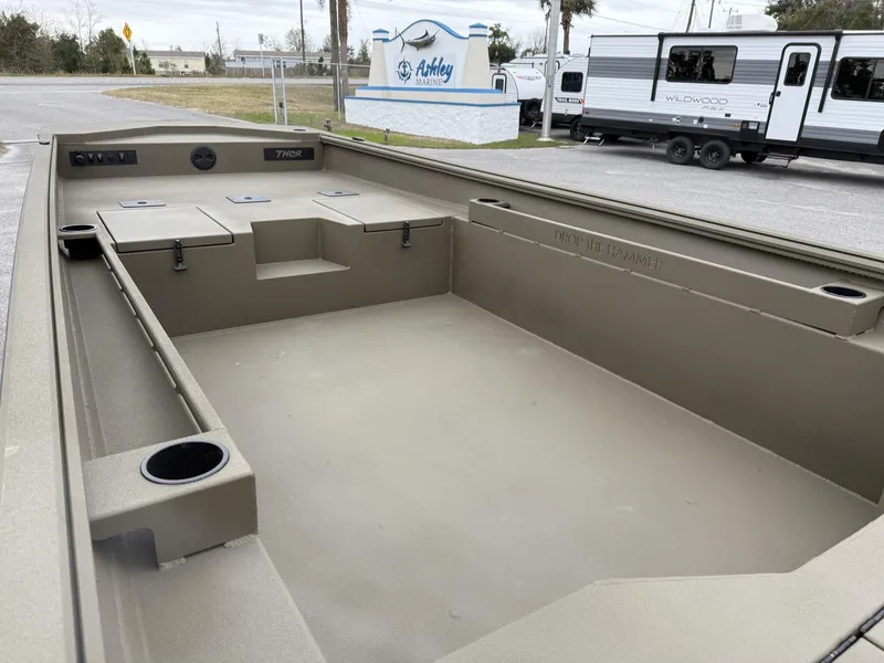 Slide: The Image of 2025 Thor LAKE HAMMER 1860 boat interior at Ashley Marina, featuring spacious deck and storage. - 8