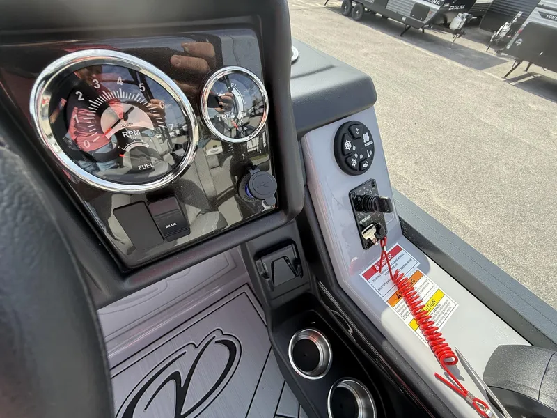 Slide: The Image of Control panel of 2025 Veranda Relax Series VR25RC boat, featuring RPM and fuel gauges. - 11