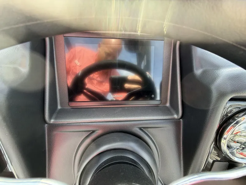 Slide: The Image of Dashboard of 2025 Veranda Relax Series VR25RC with Garmin display and steering wheel reflection. - 12