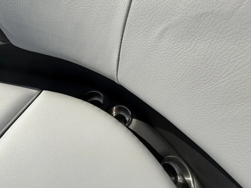 Slide: The Image of 2025 Veranda Relax Series VR25RC interior with sleek, light gray leather upholstery and cup holders. - 16