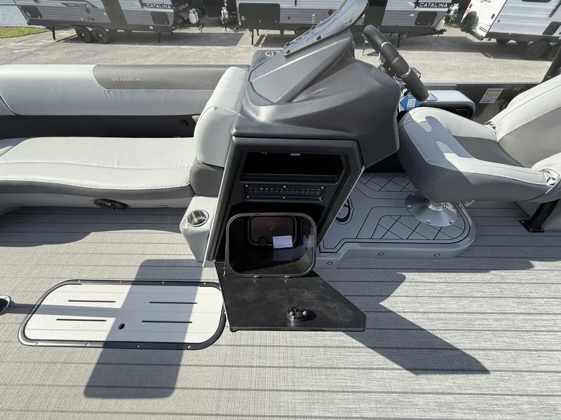 Slide: The Image of 2025 Veranda Relax Series VR25RC boat interior with seating and control console. - 4