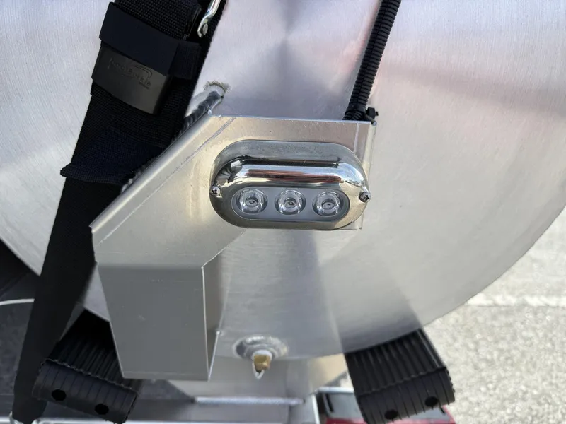 Slide: The Image of Close-up of Veranda Relax Series VR25RC pontoon boat detail, featuring a mounted light fixture. - 8