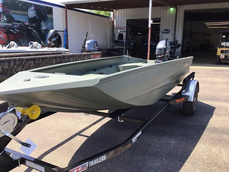 Slide: The Image of 2025 Edge Duck Boats 550-SP on trailer, displayed outside a marine shop. - 10