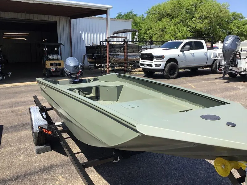 Slide: The Image of 2025 Edge Duck Boats 550-SP on trailer, parked near a white truck. - 13