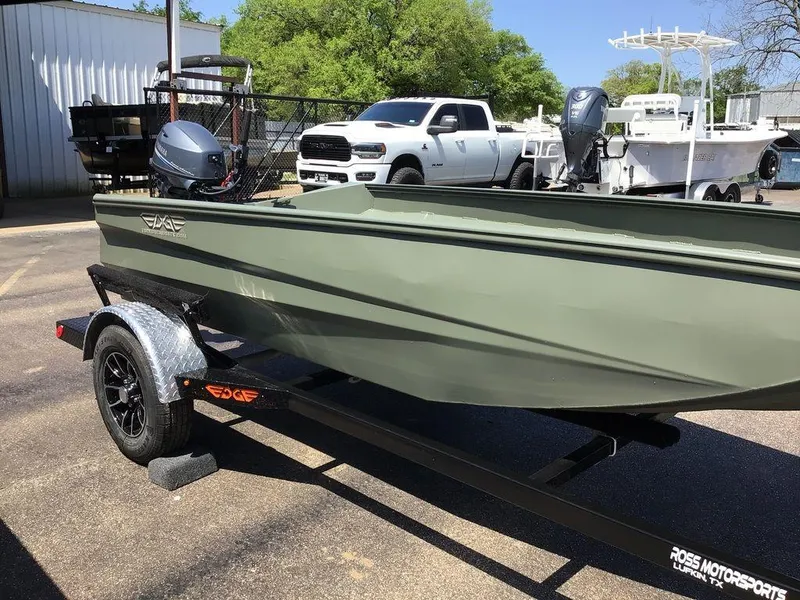 Slide: The Image of 2025 Edge Duck Boats 550-SP on trailer, parked outdoors near vehicles. - 14