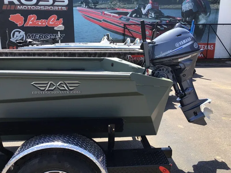 Slide: The Image of 2025 Edge Duck Boats 550-SP with Yamaha motor, displayed at a motorsports event. - 4