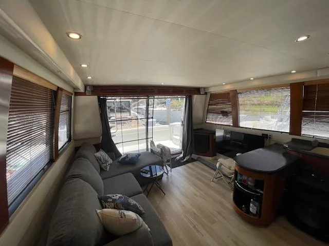 Slide: The Image of Luxurious interior of 2000 Carver 530 Voyager Pilothouse with modern furnishings and ample natural light. - 12