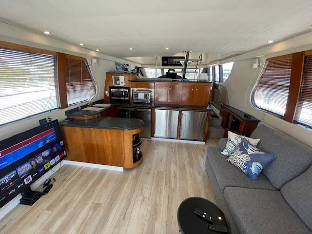 Slide: The Image of Luxurious interior of 2000 Carver 530 Voyager Pilothouse with modern kitchen and cozy seating area. - 15